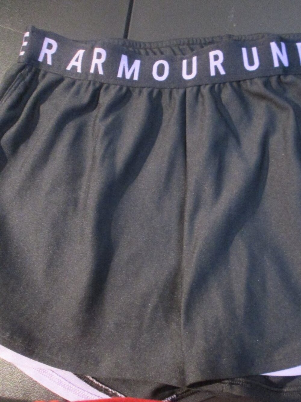 Juniors sz M Under Armour shorts Black with purple on bottom EUC